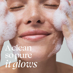 TULA Supersize Purifying Face Cleanser applied to skin by hand for makeup removal