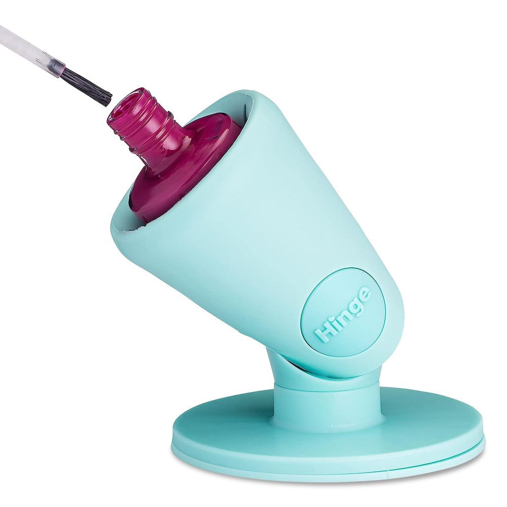 Tweexy Hinge untippable bottle tilted for stable, spill-free nail polish.