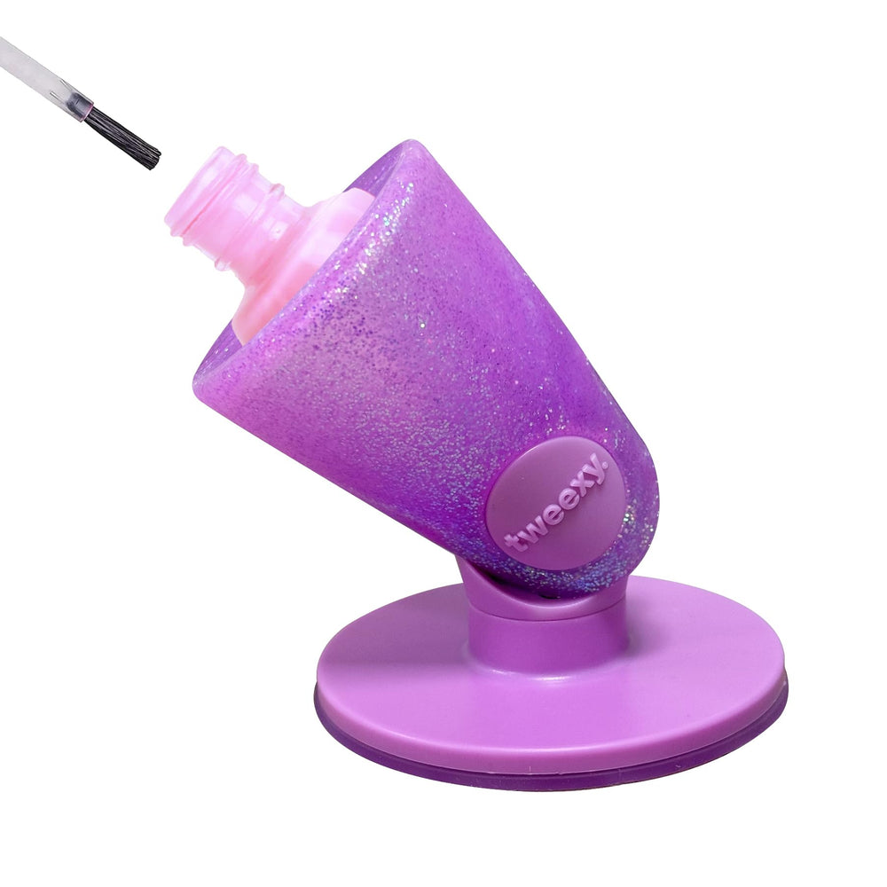 Tweexy Hinge untippable holder on surface keeps polish steady for precise manicures.