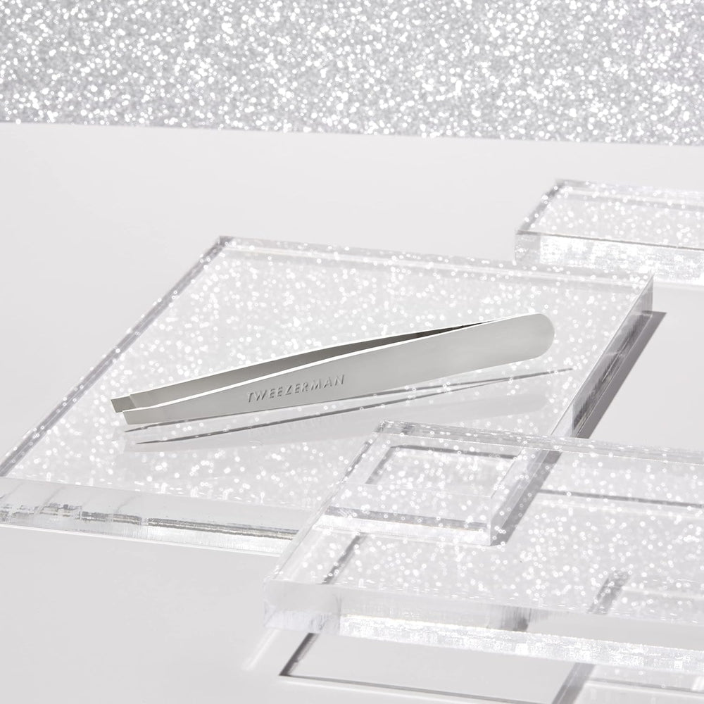 Tweezerman brow prep with warm cloth demonstrates comfortable pre-removal routine.