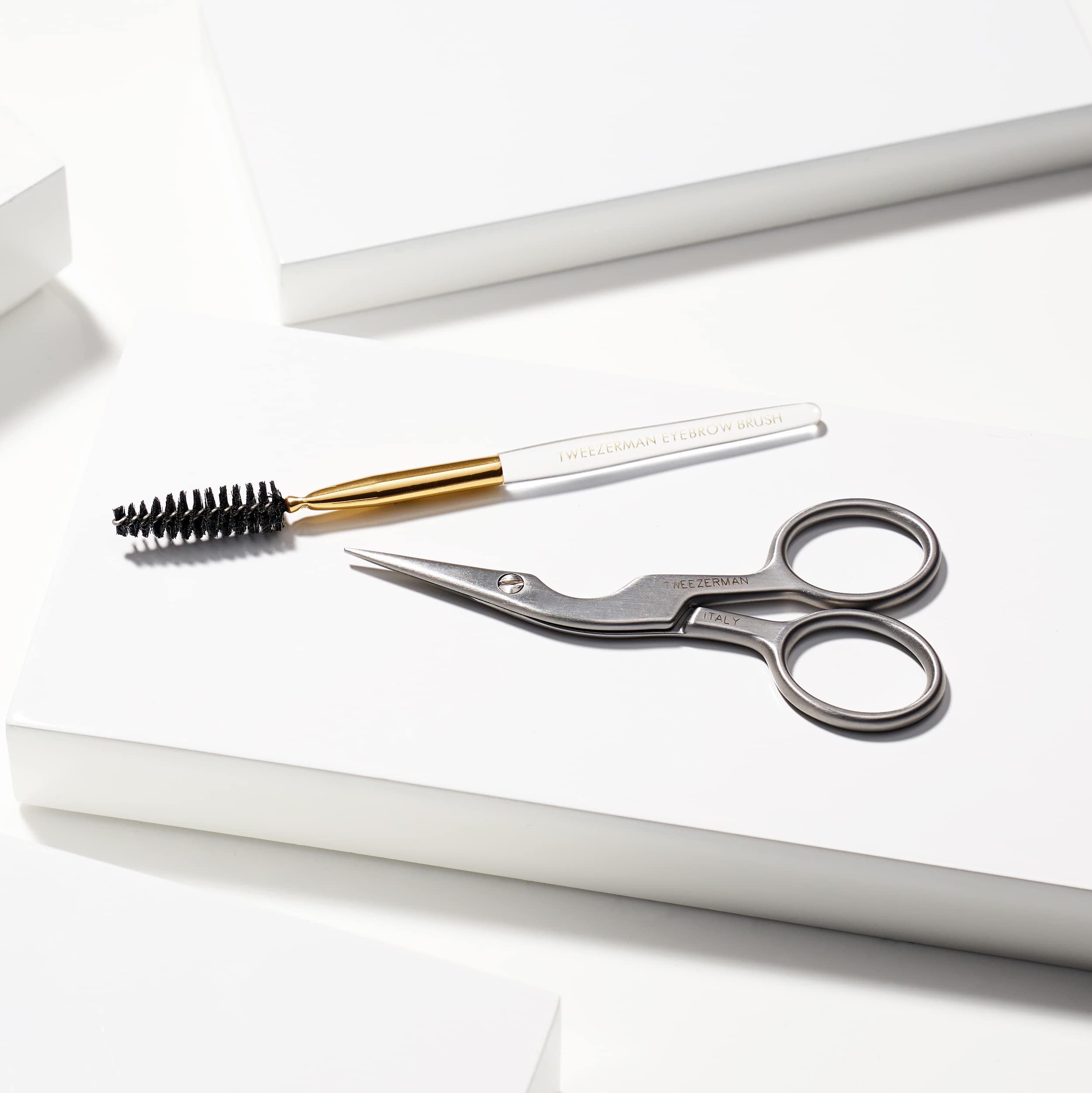 Tweezerman brow trimming process image shows hair-by-hair precision