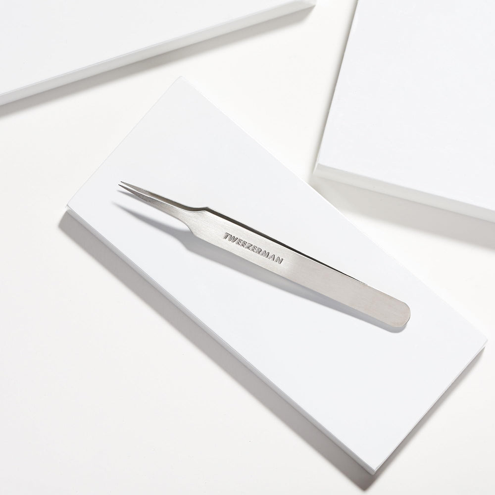 Tweezerman detailed closeup tips showcases sharp points for precise removal.