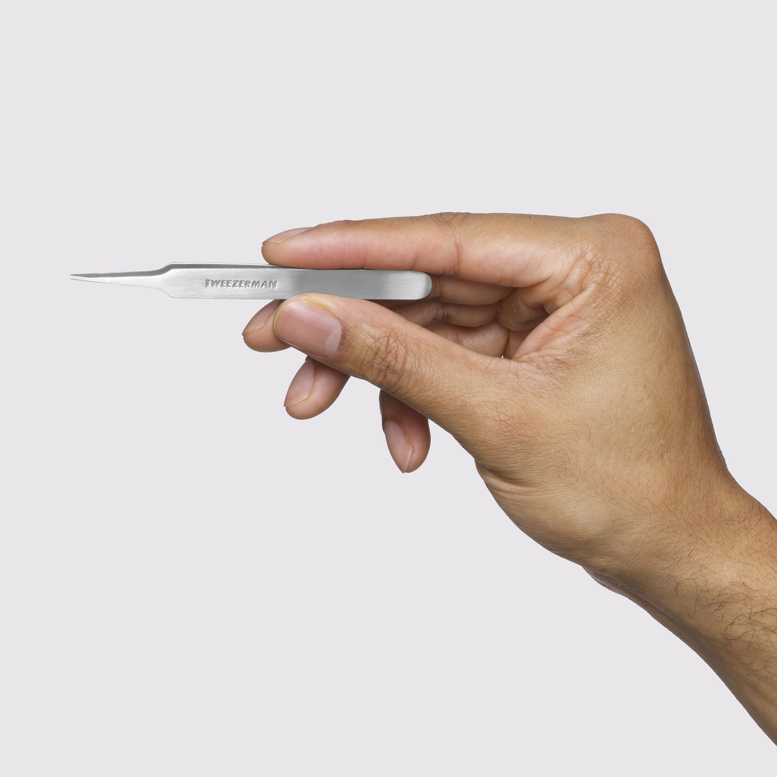 Tweezerman ergonomic handle grip closeup emphasizes comfortable control.