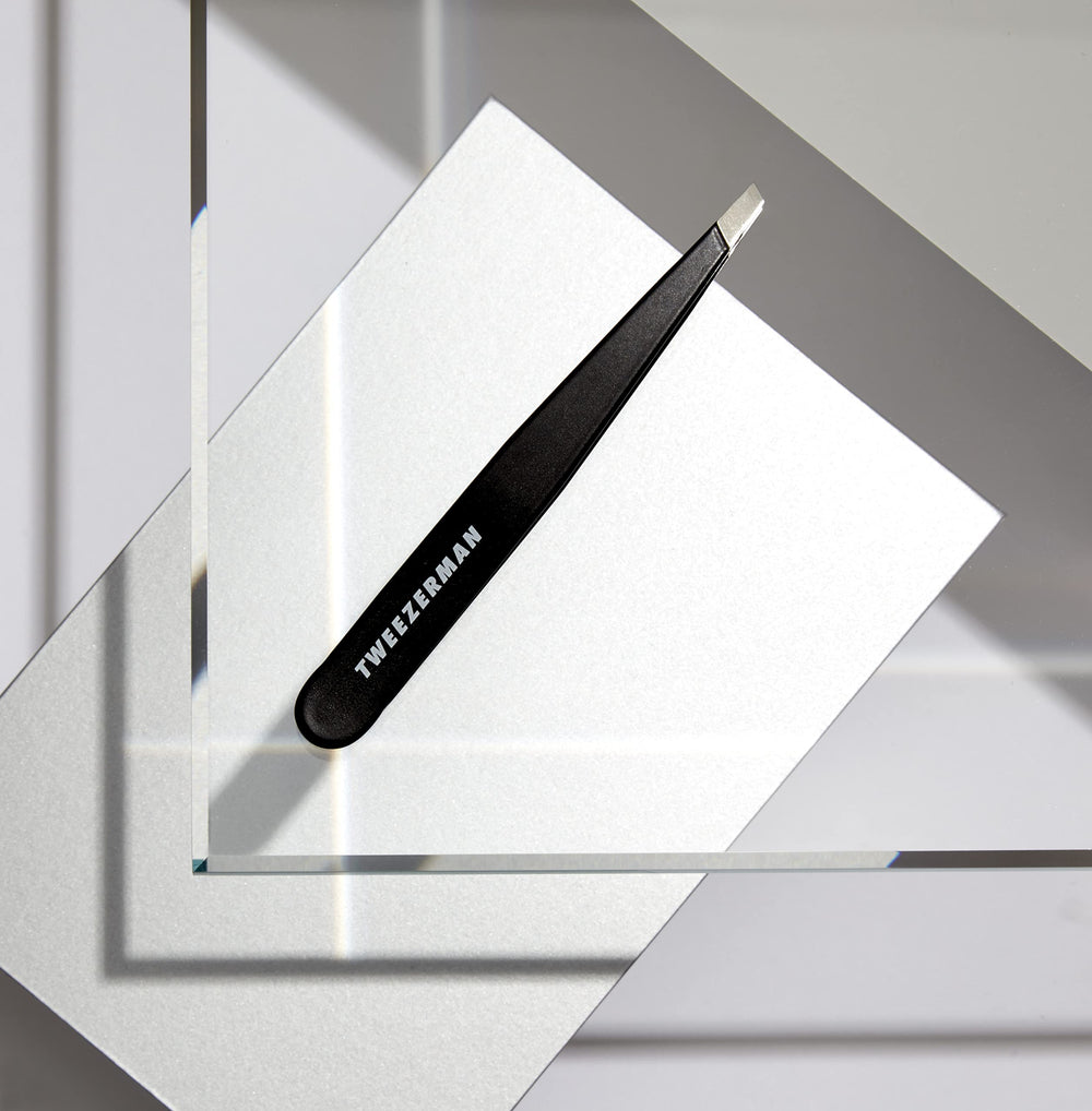 Tweezerman G.E.A.R. Slant Tweezer Midnight angled tips facilitate pulling hair from root.