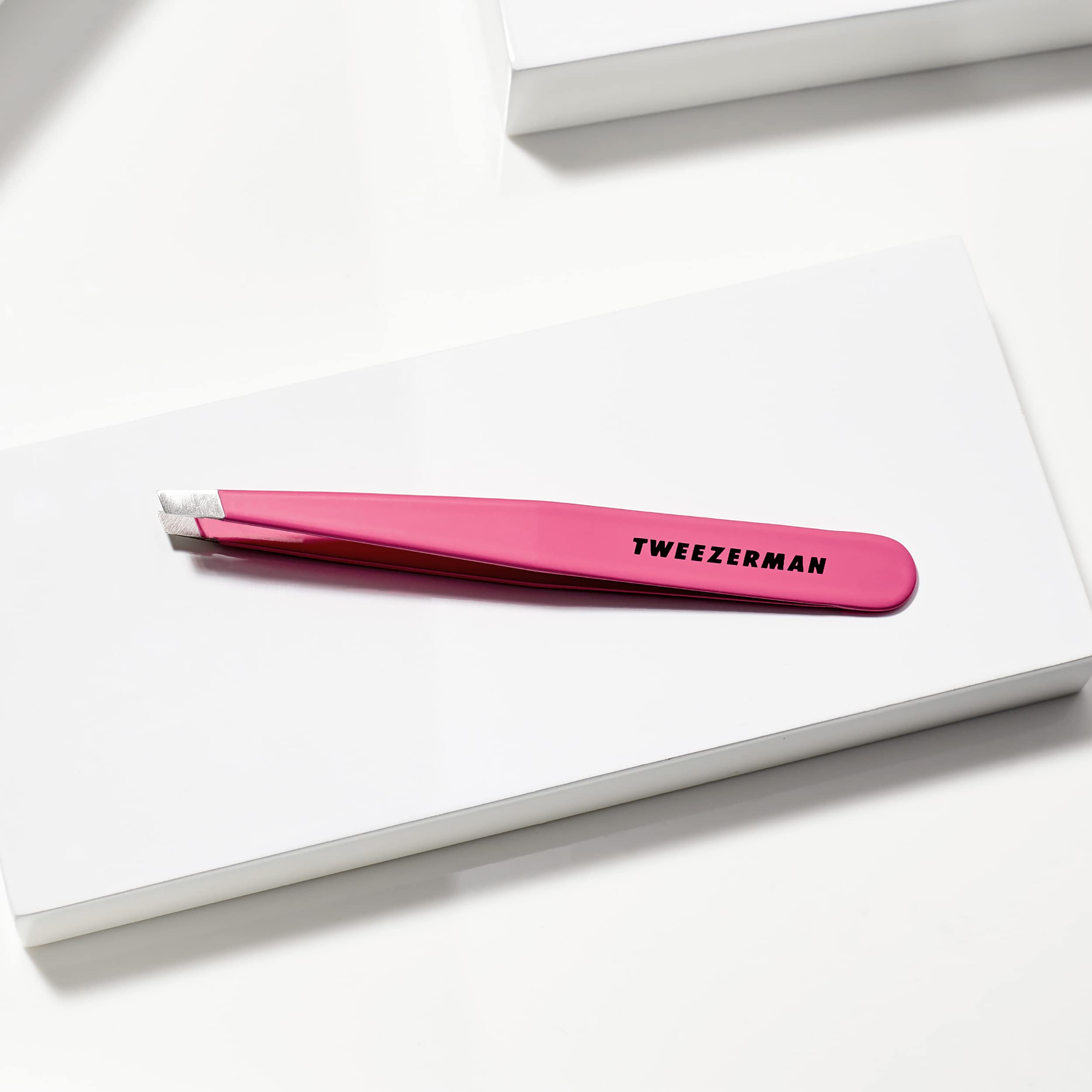 Tweezerman hand-filed tips closeup emphasizes durable, precise grip for consistent hair removal.