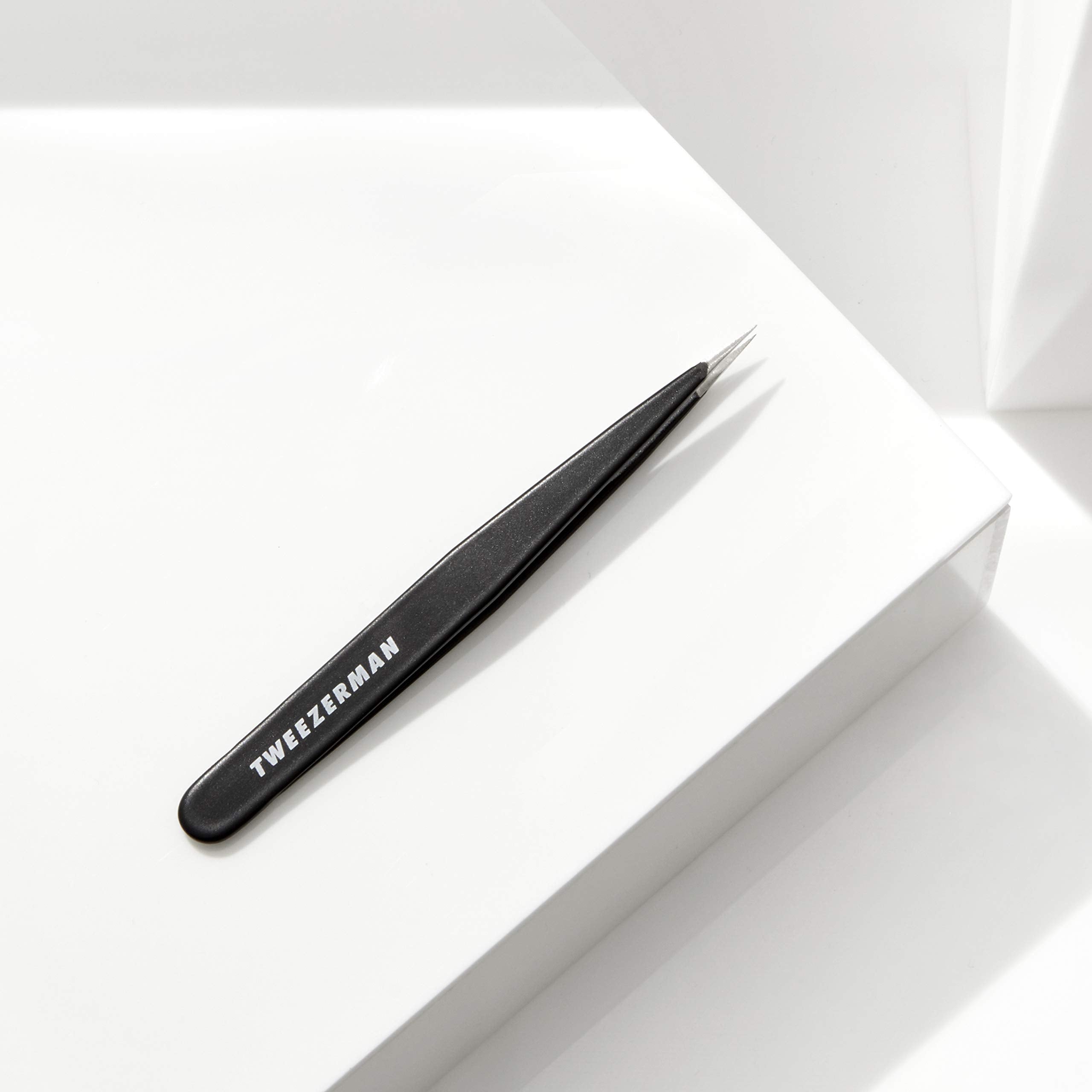 Tweezerman Midnight Sky holding the tweezer for easy brow grooming