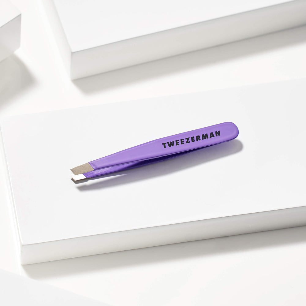 Tweezerman Mini Slant Travel Tweezers Blooming Lilac used with warm cloth prep.