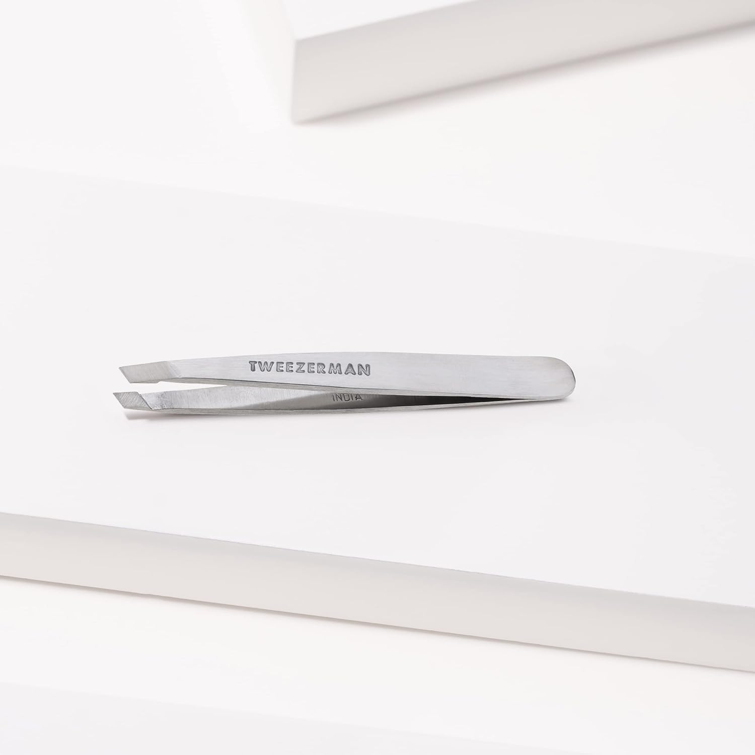 Tweezerman Mini Slant Tweezer brow prep usage for gentle shaping.