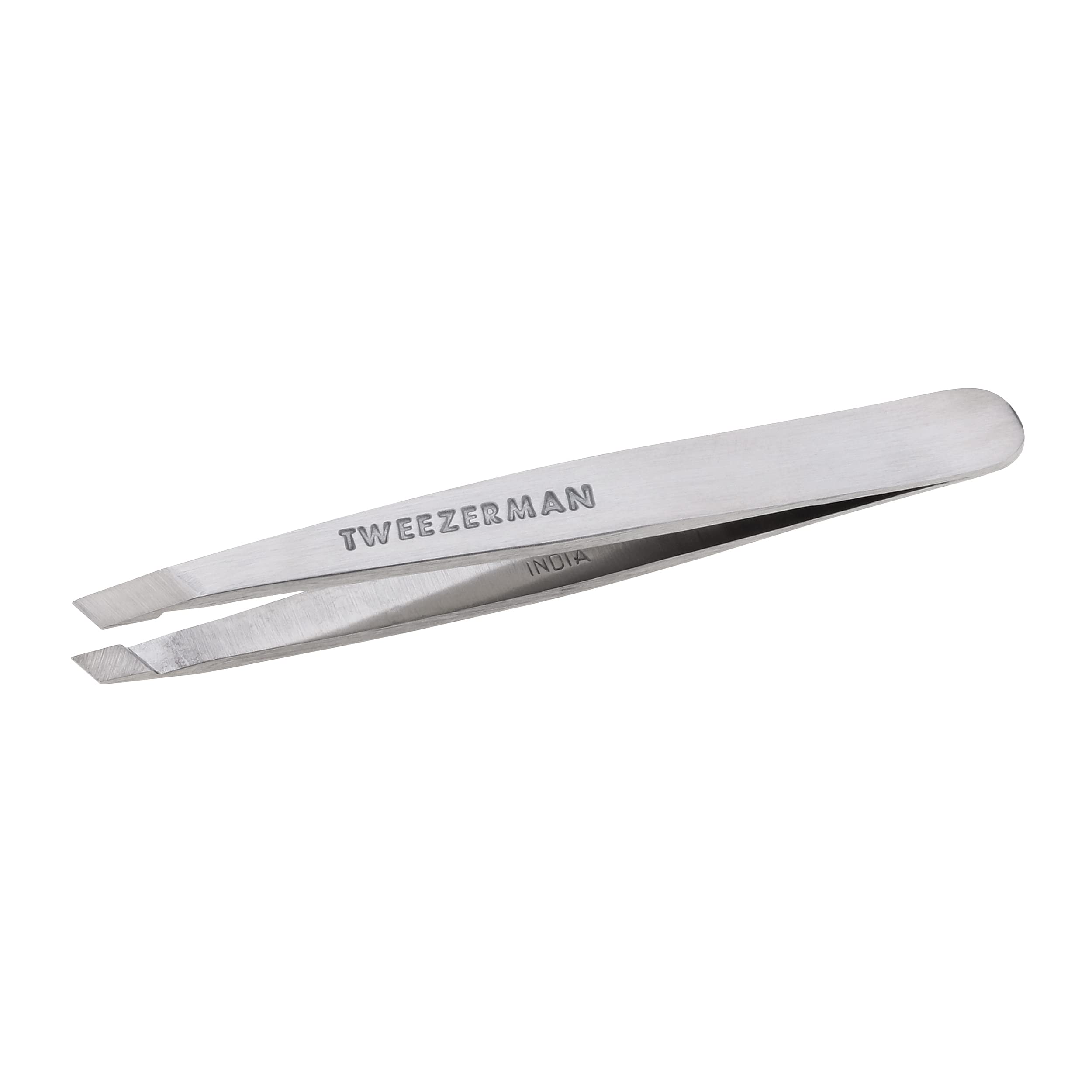 Tweezerman Mini Slant Tweezer close-up shows compact travel-friendly design.