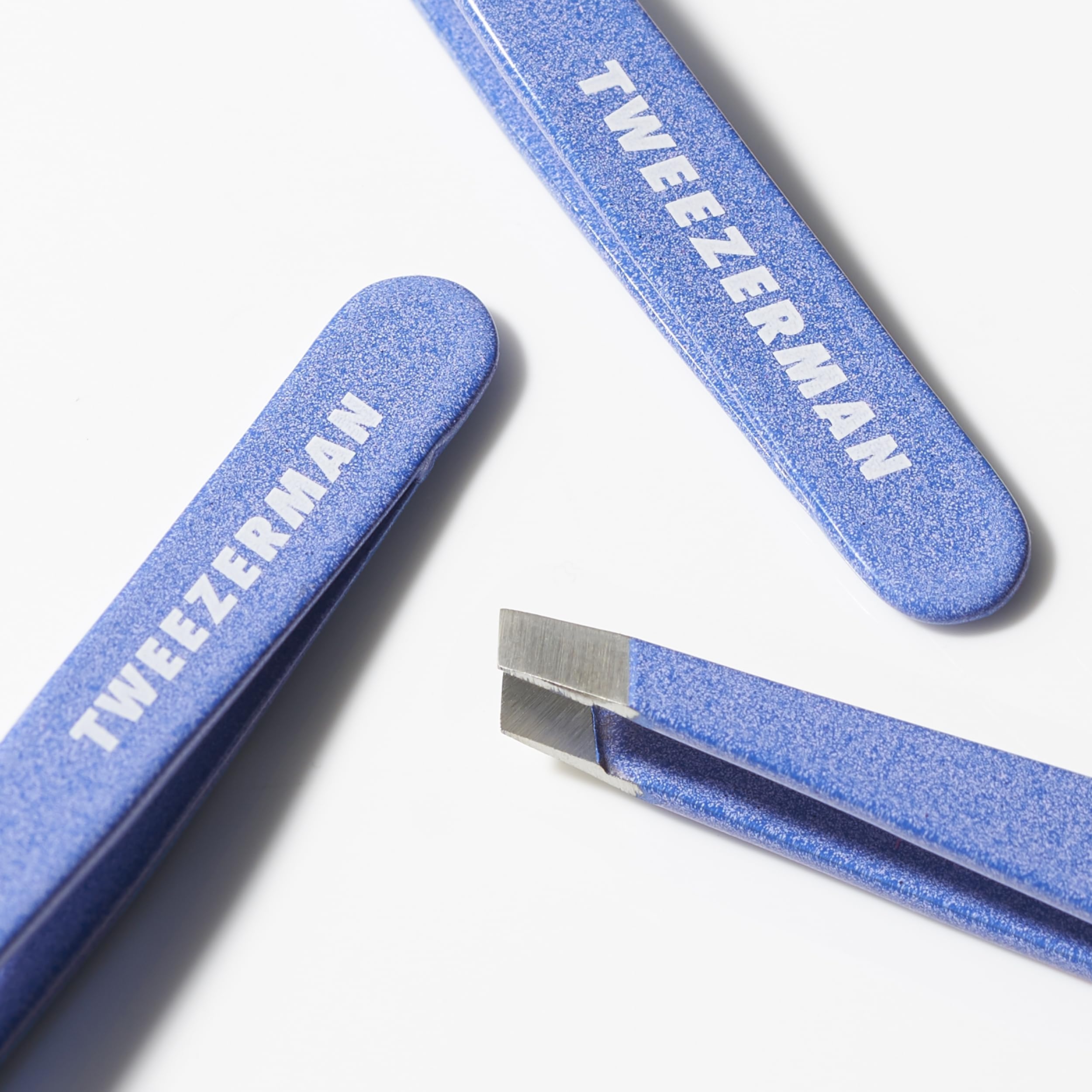 Tweezerman Mini Slant Tweezer tips closeup showcasing hand-filed precision.