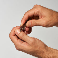 Tweezerman Mini Squeeze Cuticle Nipper textured grip for controlled trimming.