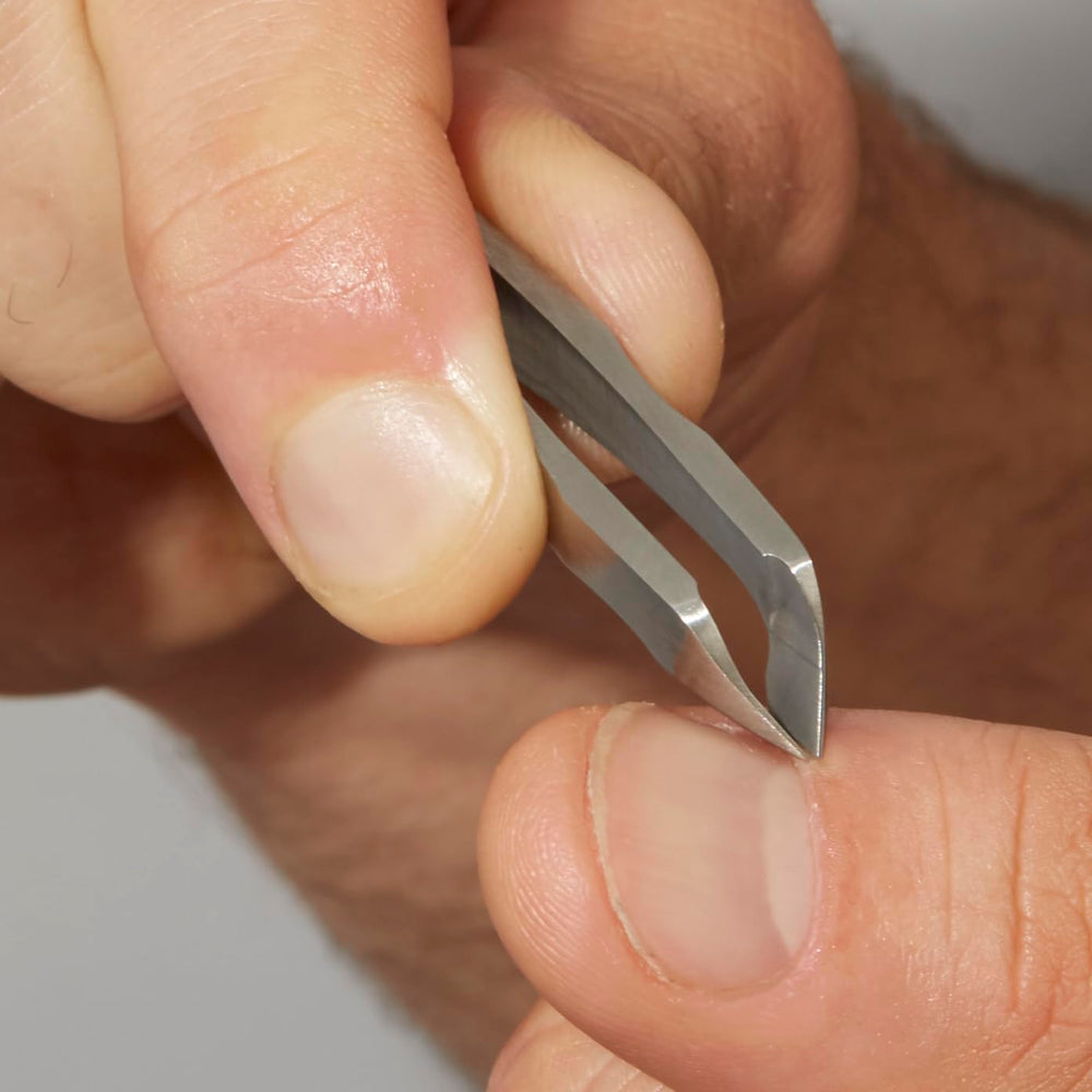 Tweezerman Mini Squeeze Cuticle Nipper compact size fits travel grooming kits.