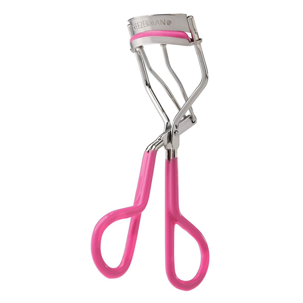 Tweezerman Neon Pink Comfort Grip Eyelash Curler open for base-to-tip curl delivering a wide-awake look.