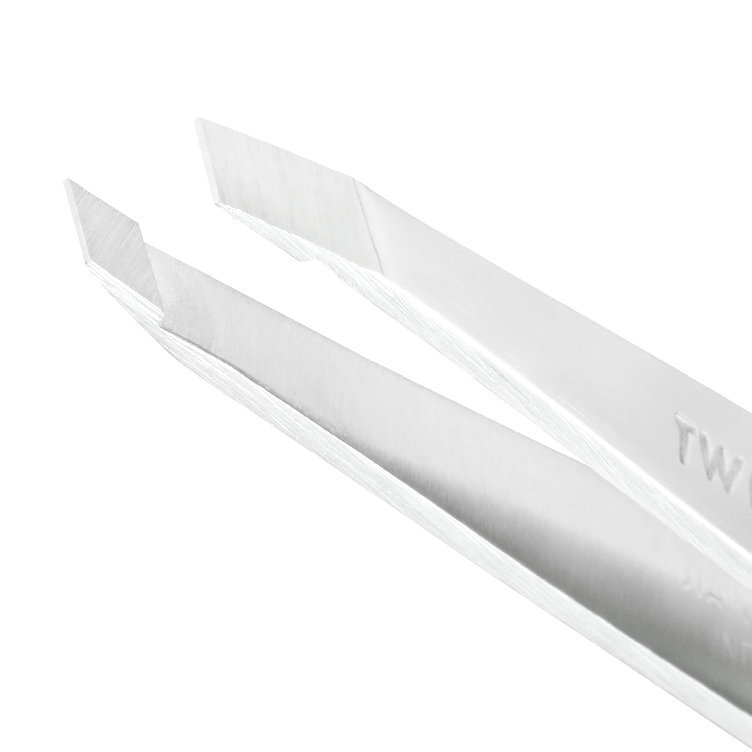 Tweezerman Platinum Silver tweezer in use with firm grip for controlled hair removal.