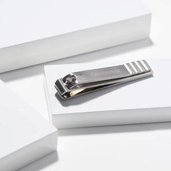 Tweezerman professional stainless steel toenail clipper with secure grip for controlled trimming.