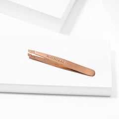 Tweezerman rose gold mini slant tweezer hand grip enables precise tweezing