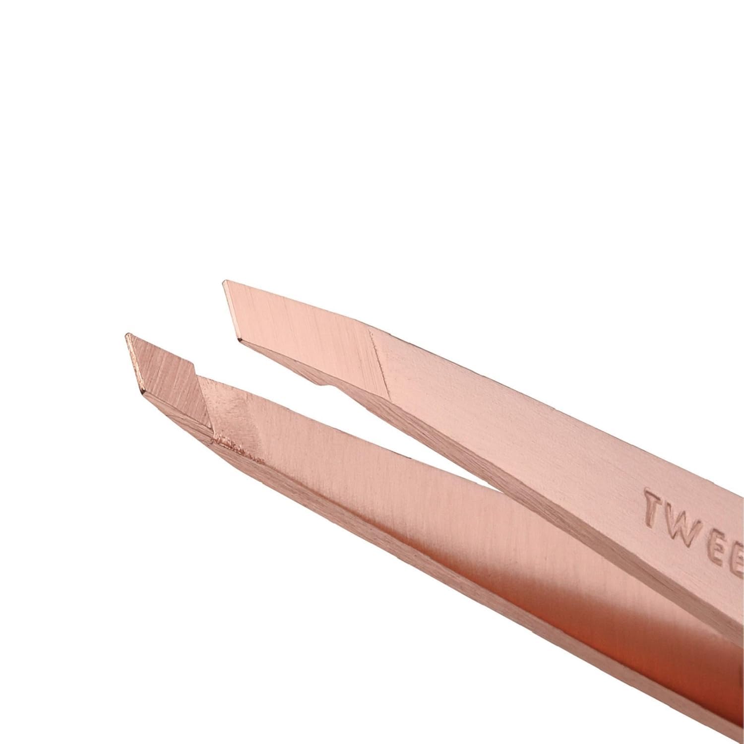 Tweezerman rose gold petite slant tweezers—aligned tips for reliable hair removal.