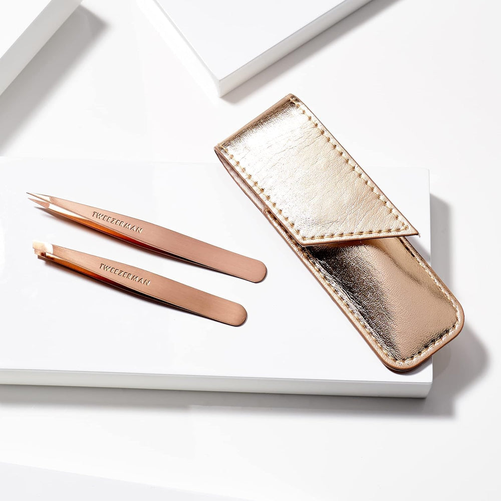 Tweezerman rose gold tweezers with aligned tips—consistent grip for brow shaping.