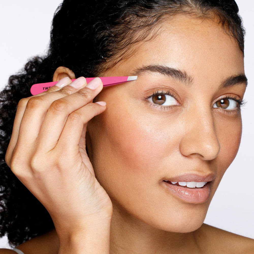 Tweezerman slant tweezer closeup highlights aligned tips for firm grip and hair removal.