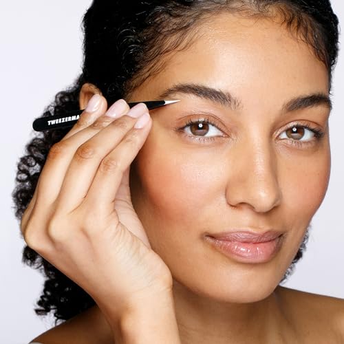 Tweezerman stainless-steel slant tweezer with aligned tips delivering consistent hair grip.