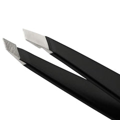 Tweezerman stainless-steel slant tweezer demonstrates hair-grab precision against the brow line.