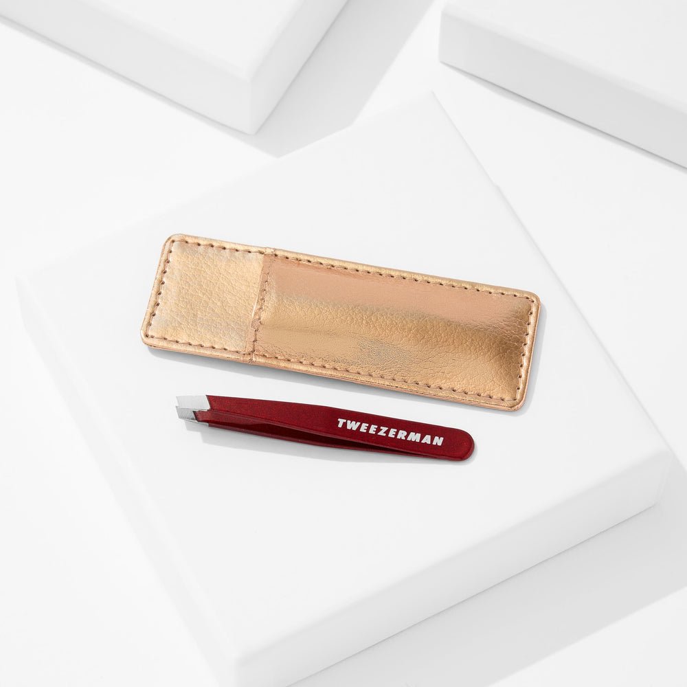 Tweezerman Vintage Rose Mini Slant Tweezer in use for precise plucking
