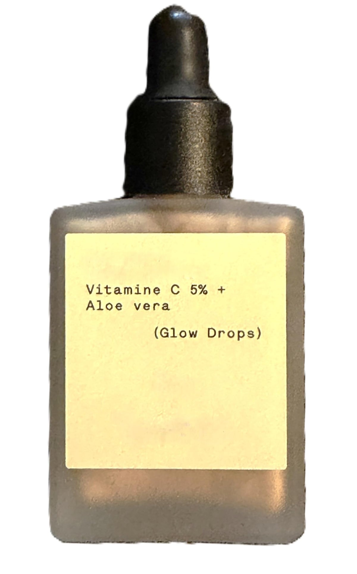 Typology Glow Drops bottle close-up highlighting vegan, fragrance-free formula for comfortable wear.