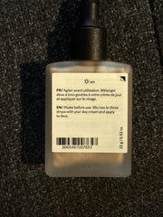 Swatch of Typology Glow Drops showing buildable radiance on skin.