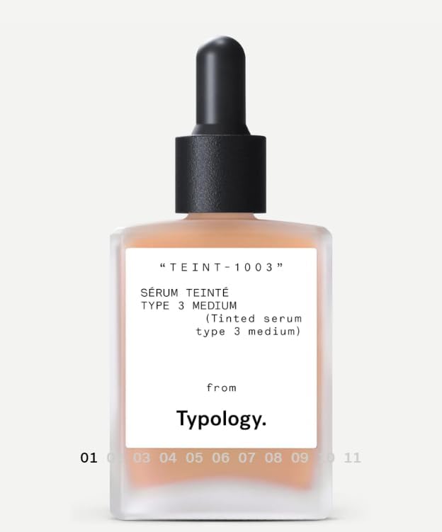 Typology tinted serum being applied with brush for easy, even coverage.