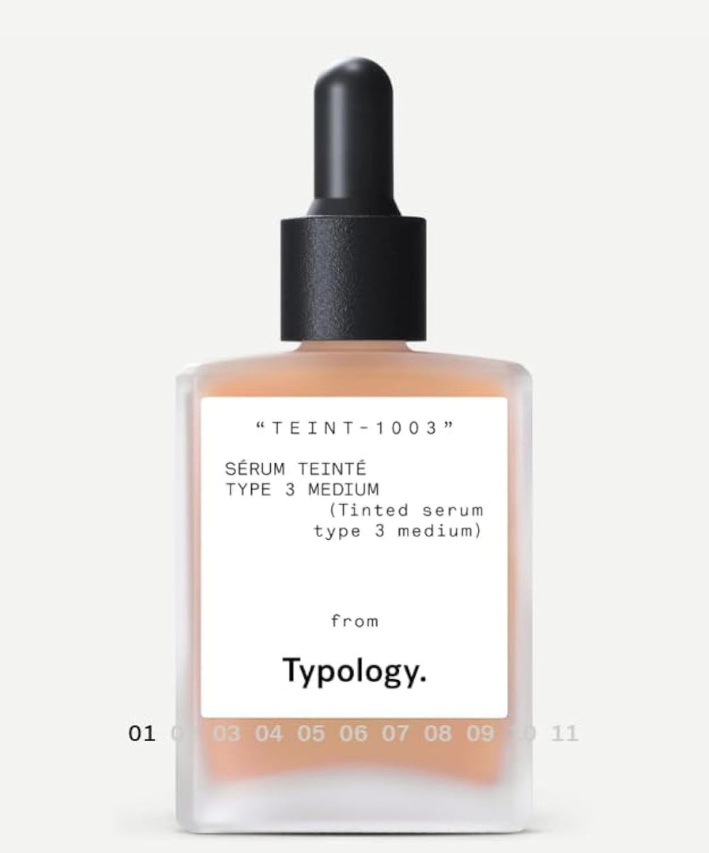 Typology tinted serum bottle close-up promoting radiant skin with vegan formula.