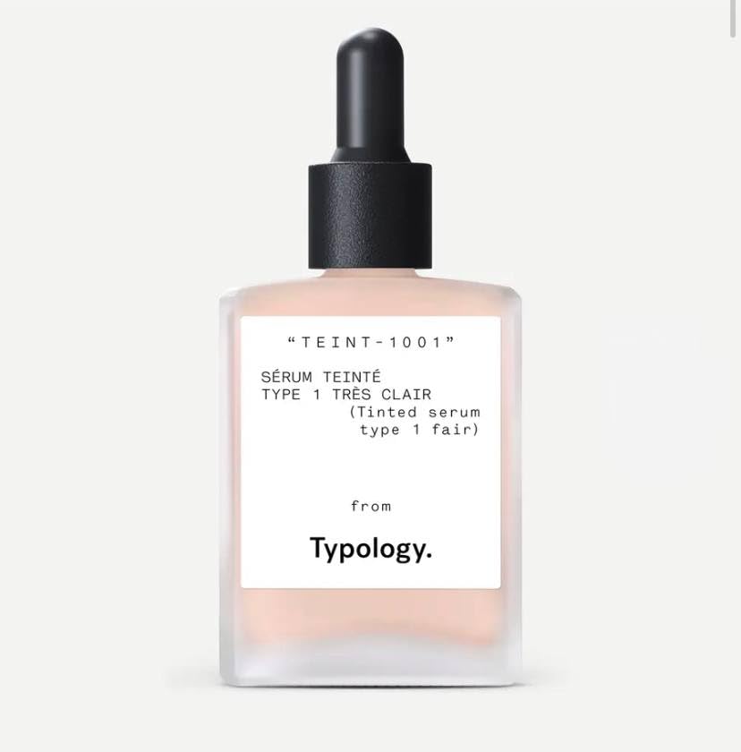 Typology tinted serum bottle with pump offers light coverage for a natural finish.