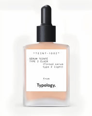 Typology Tinted Serum Type 2 Light bottle close-up highlights vitamin C and hydration.