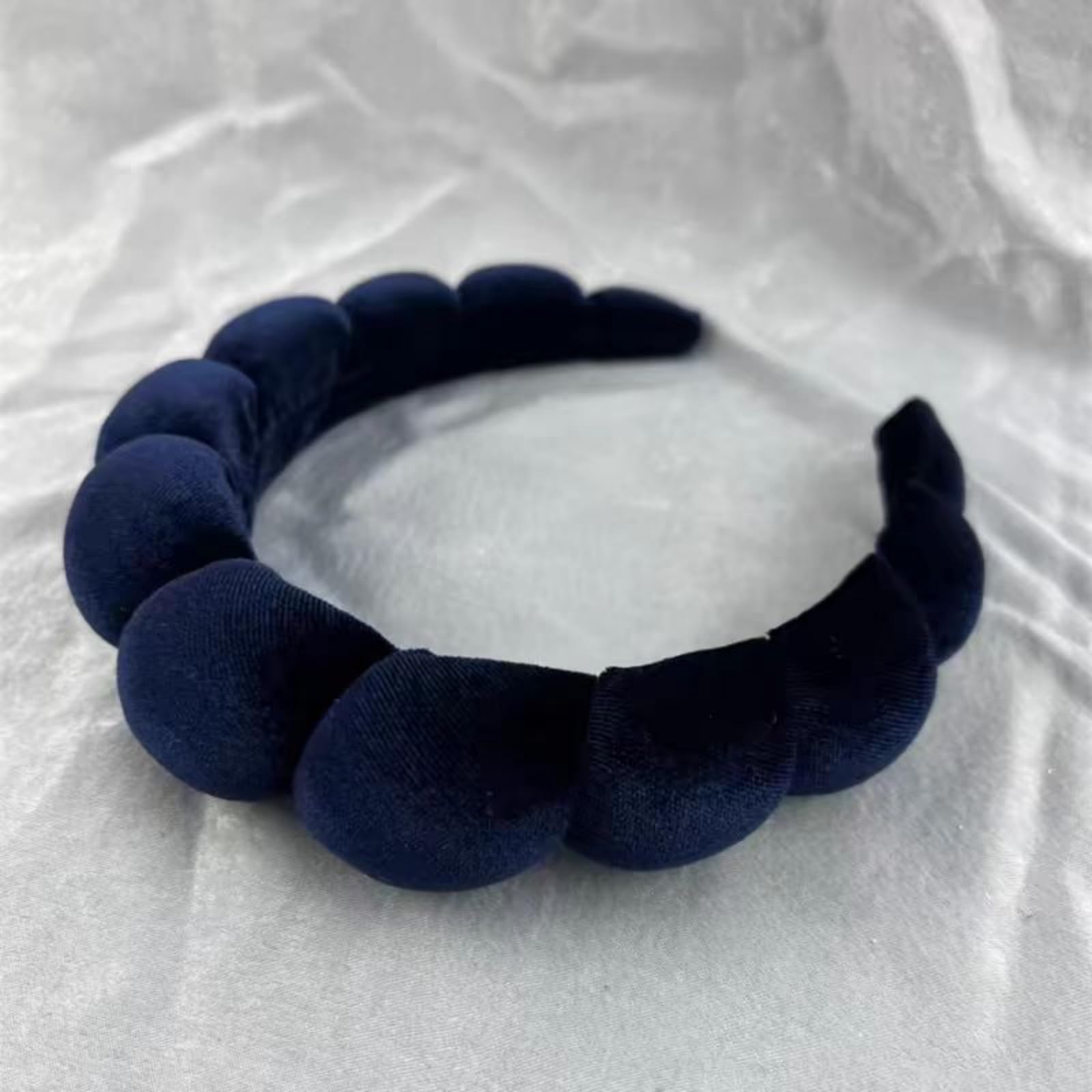 Uchyius navy blue padded headband closeup emphasizes soft fabric texture
