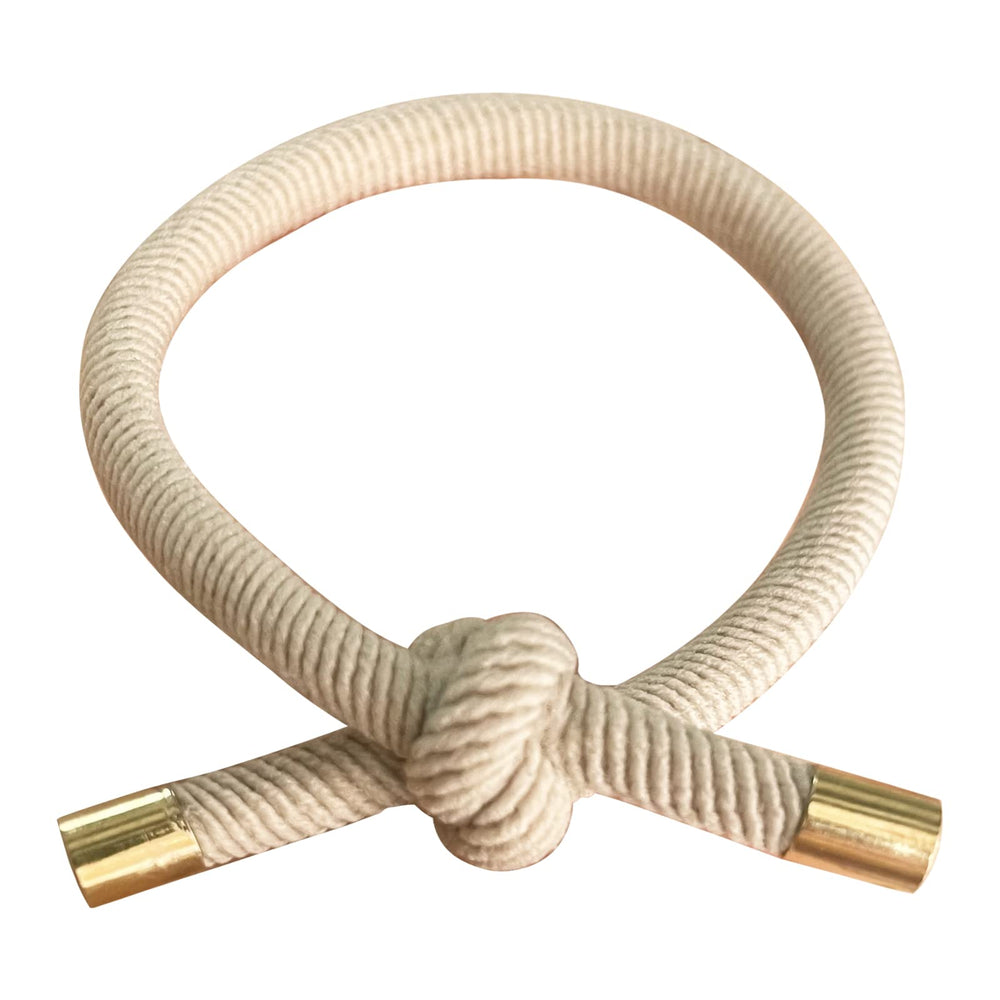 UDeBe Hair SlideProof Knot Hair Ties image highlights versatile wear as bracelets.