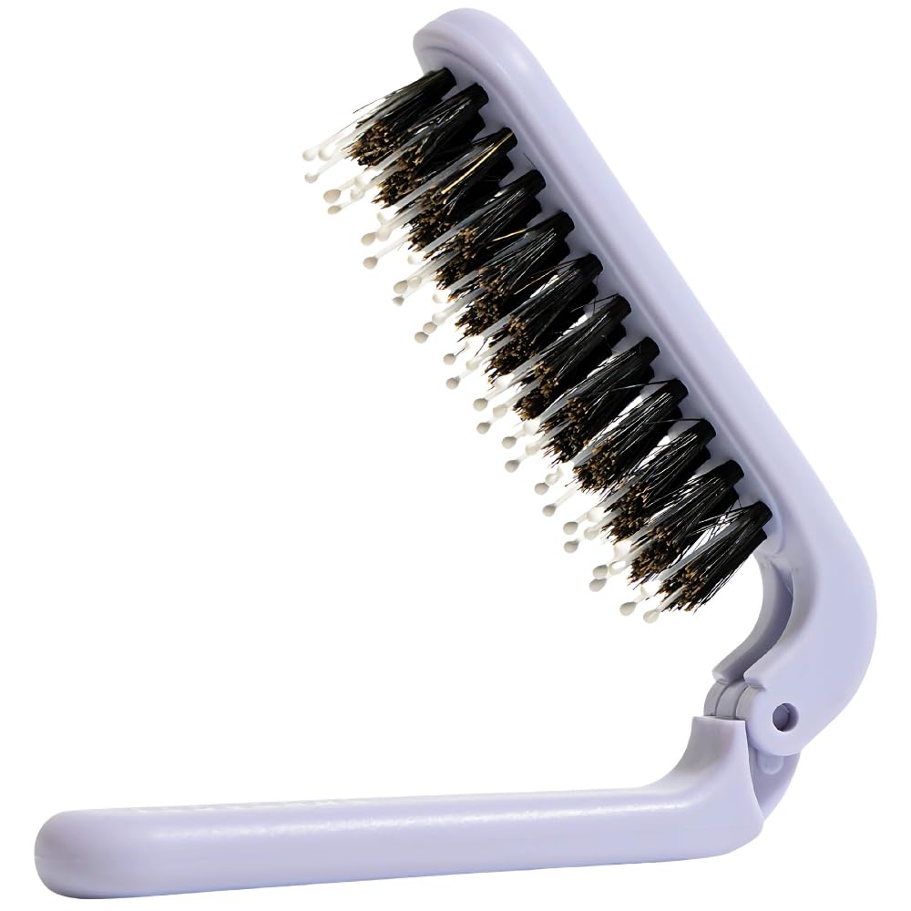 Uffy MiniPop folding brush open for on-the-go detangling.
