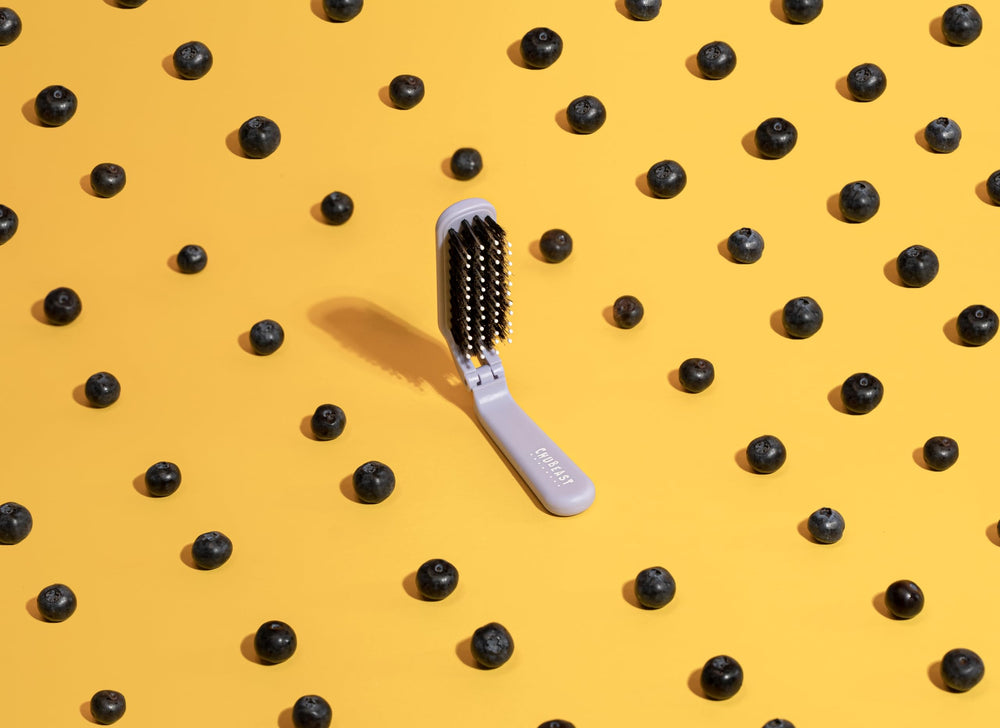 Uffy MiniPop lavender brush fits vanity and purse storage.