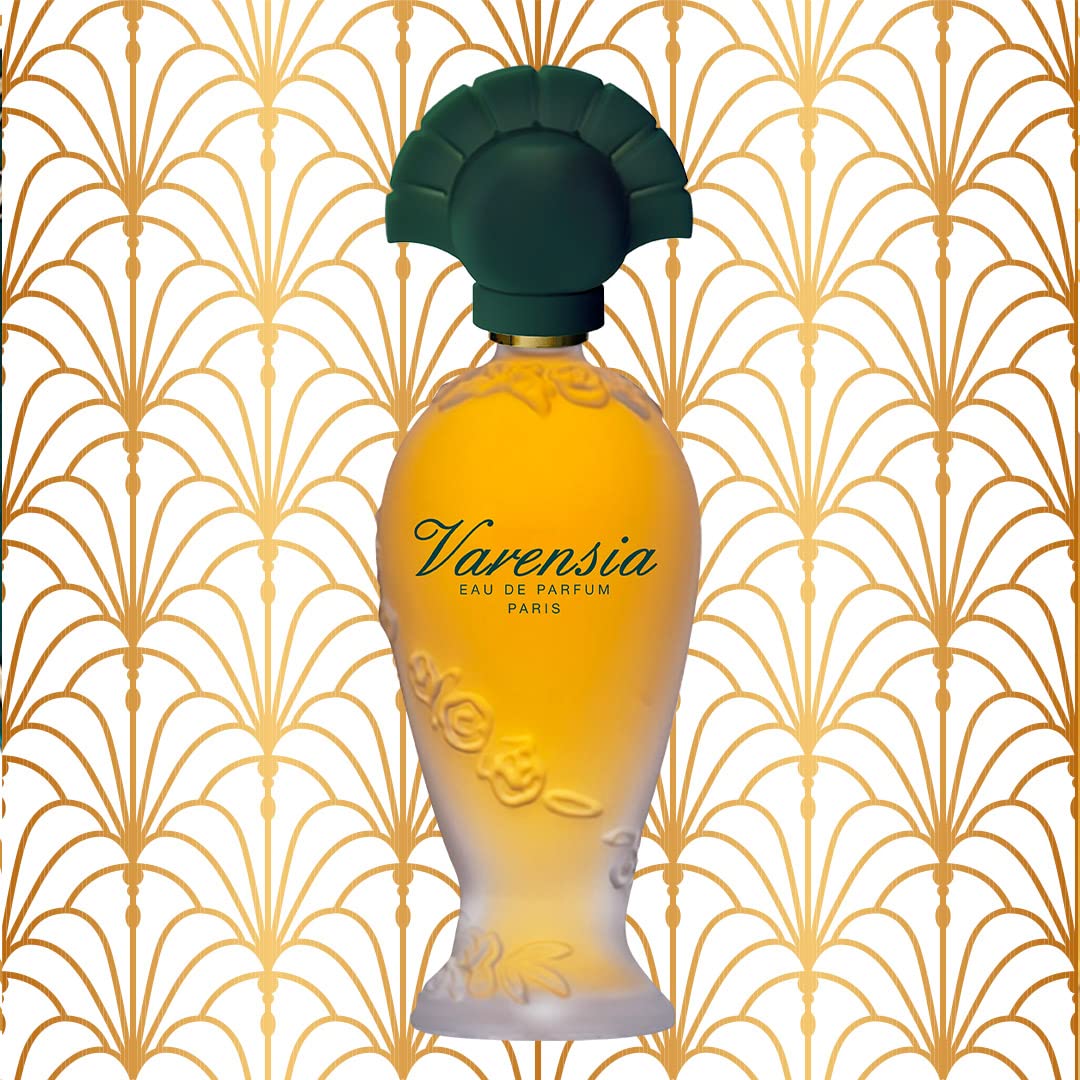Ulric de Varens Varensia application—spray bottle delivers even wear.