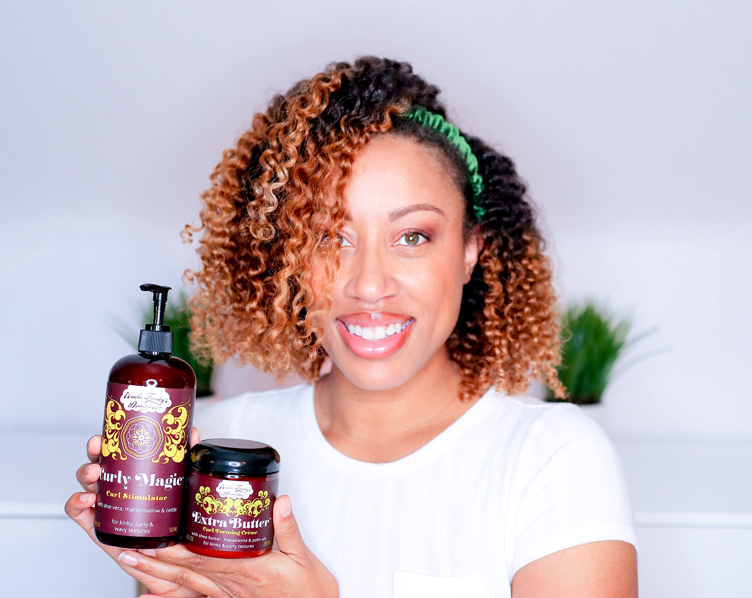 Uncle Funky's Daughter Curl cream with visible oil droplets indicating nourishing moisture.