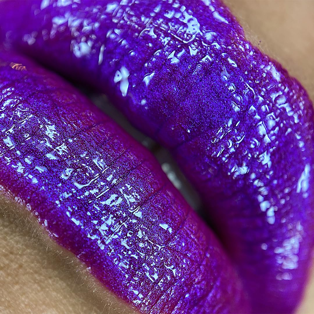 UNICORN SNOT Atomic Purple swirl on lips shows metallic shine and color payoff