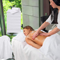 UNIMADE salon towels 24-pack folded neatly on shelf for easy access and sanitised supply.