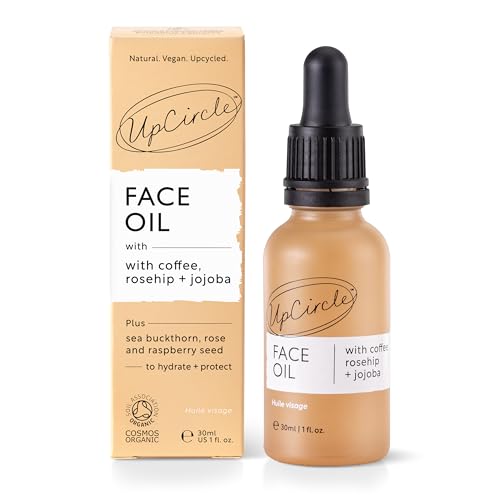 UpCircle serum dropper dispensing vitamin C and rosehip blend for brightening.