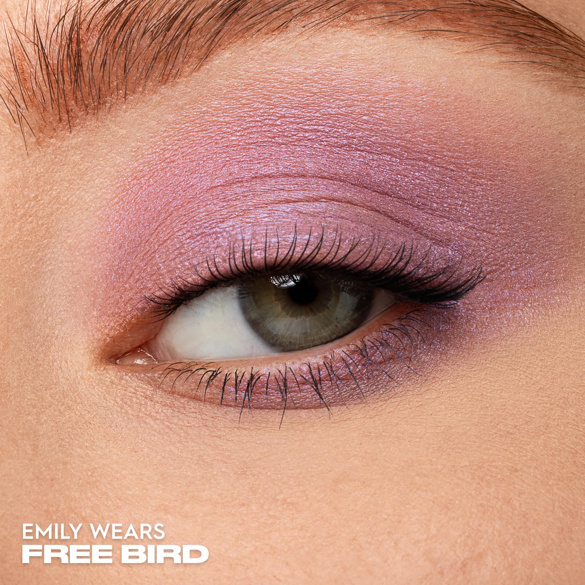 Urban Decay 24/7 Eyeshadow Single Freebird swatches reveal buildable lilac shimmer with glow.