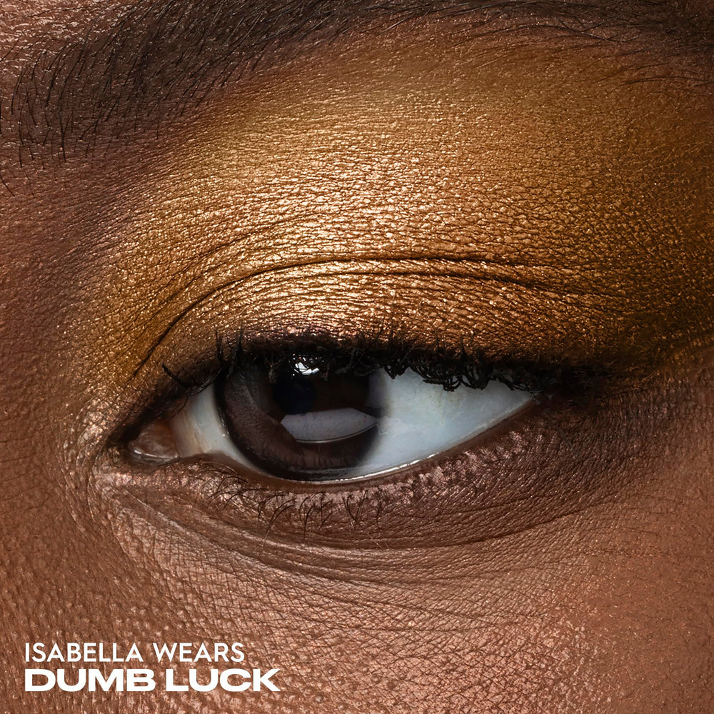 Urban Decay Dumb Luck copper metallic swatch delivers radiant shimmer.