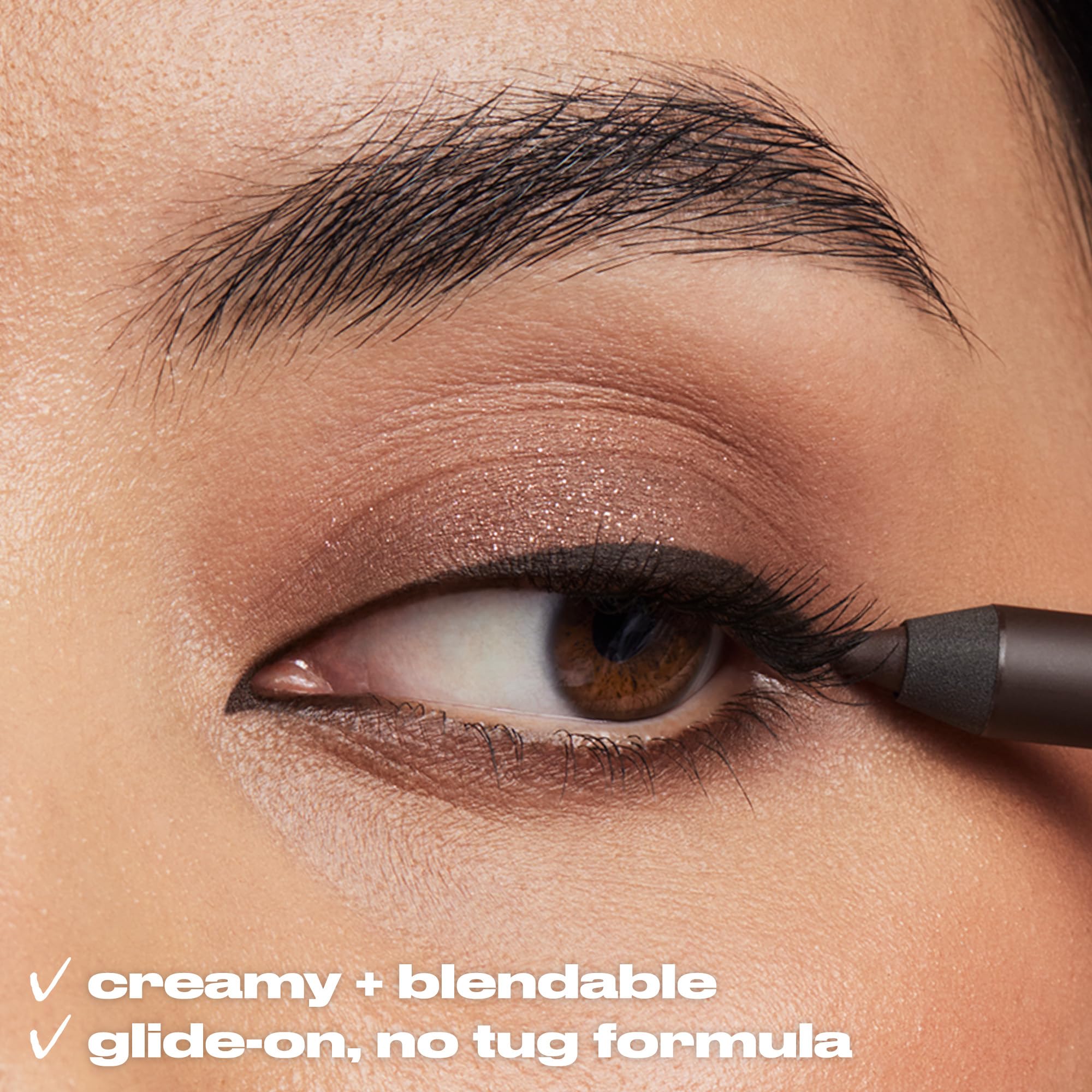 Urban Decay eyeliner pencil navy shimmer finger-swipe demonstrates long-wear