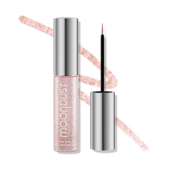 Urban Decay Moondust Liquid Eyeliner Grind application close-up showing precise pink glitter liner.