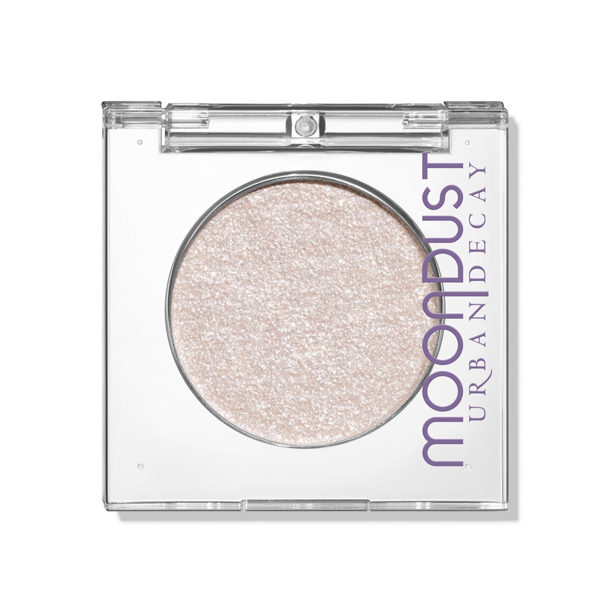 Urban Decay Moondust Space Cowboy swatch showing champagne gold sparkle for luminous eyes.