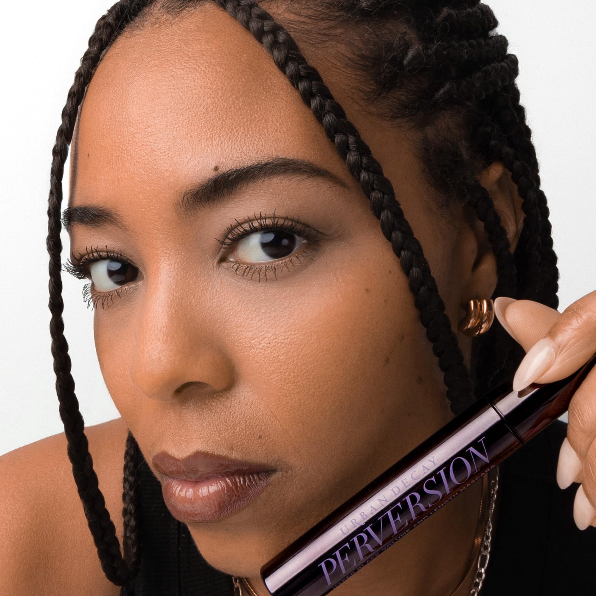 Urban Decay Perversion black pigment—intense, ultra-black lashes for definition.