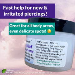 Urban ReLeaf Piercing Relief tea tree rosemary oils illustrate botanical skin care.