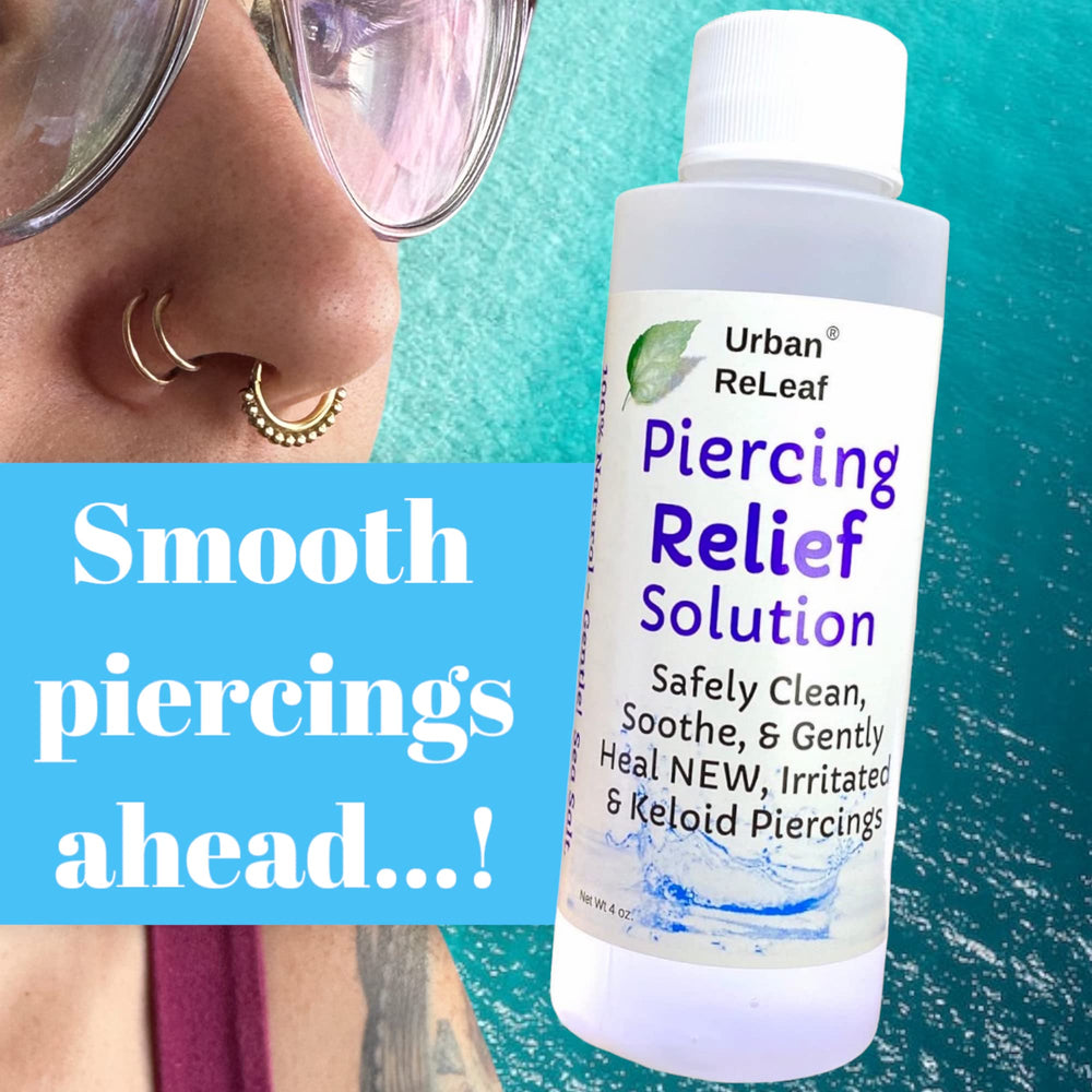Urban ReLeaf Tea Tree Oil bottle closeup for refreshing piercing care.