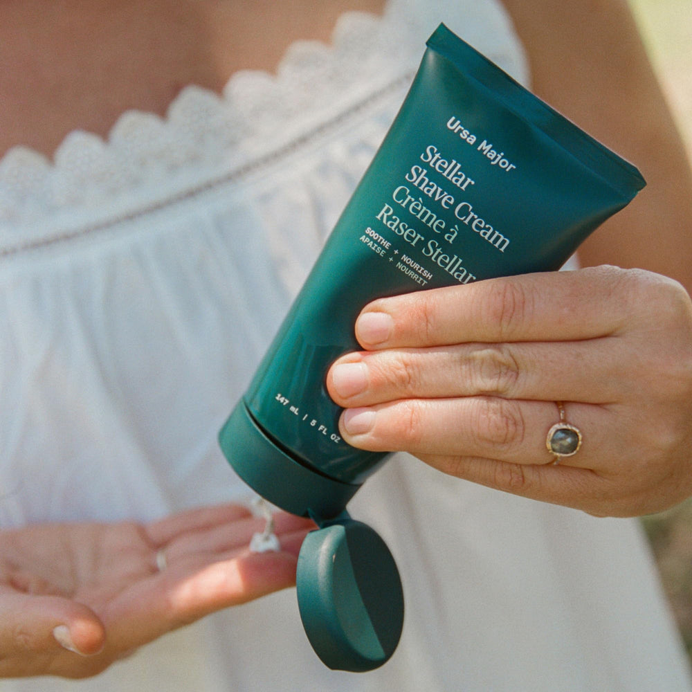 Ursa Major fragrance-free shave cream bottle on clean sink.